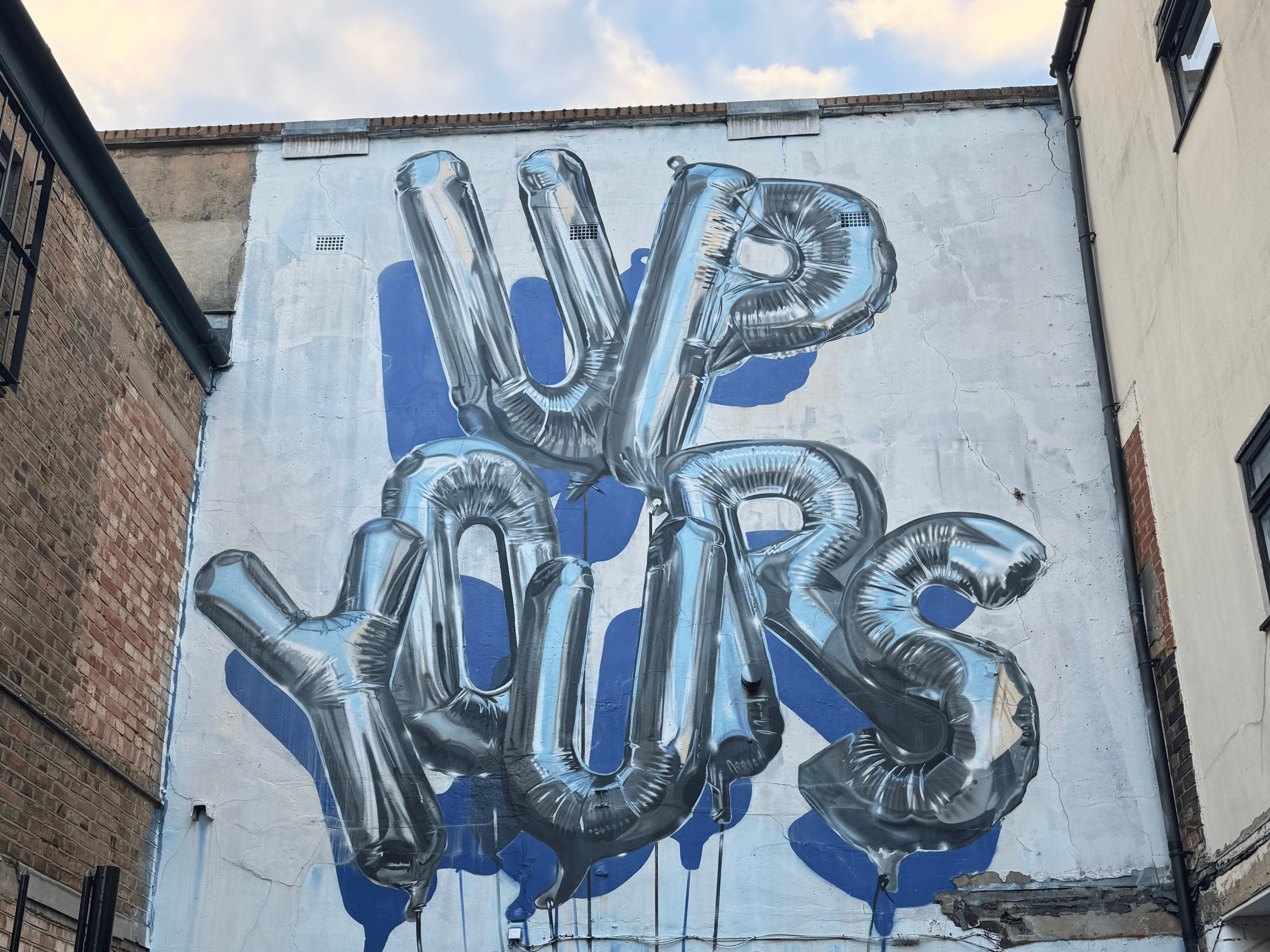 Street art mural in Shoreditch, London, during a team-building event